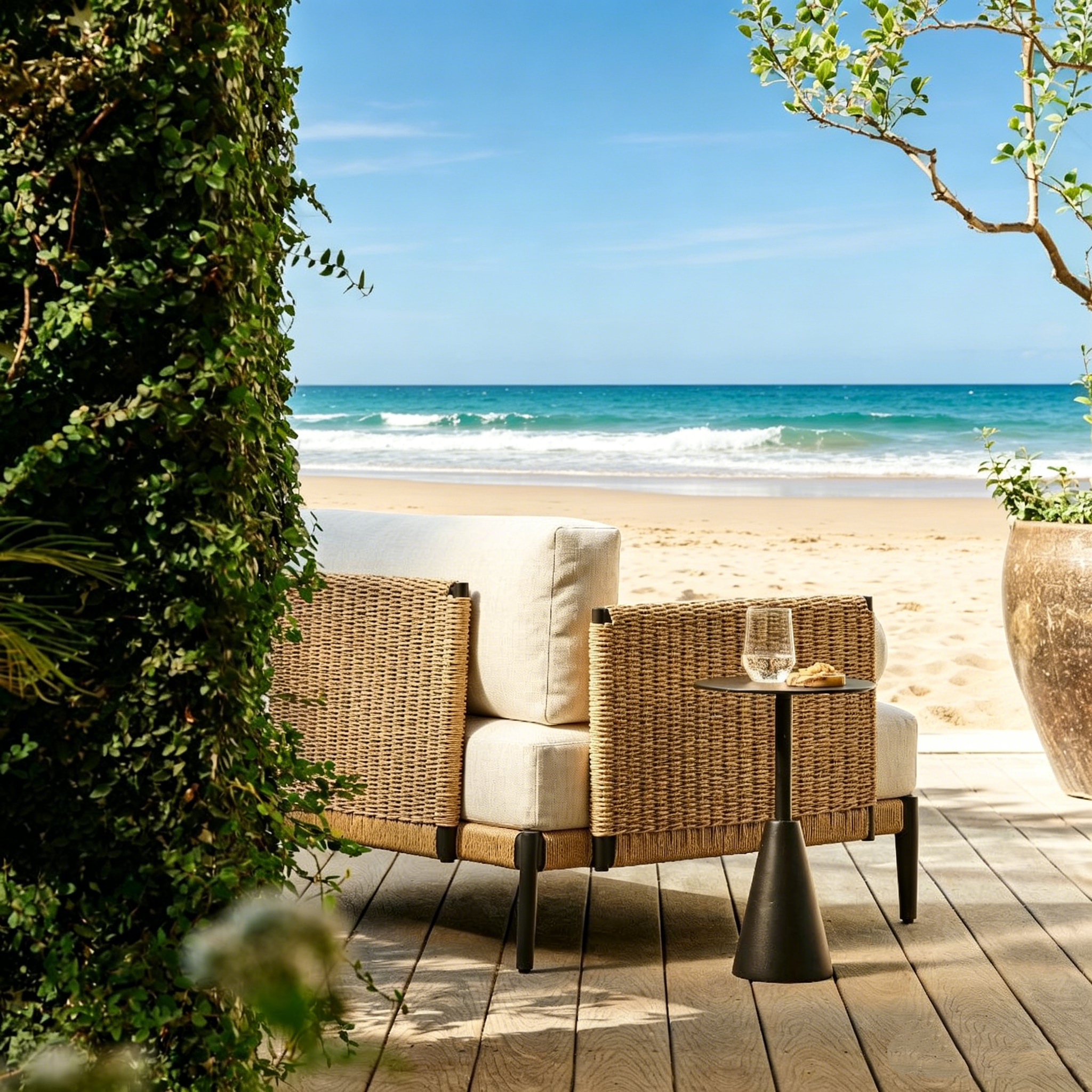 Ventura outdoor lounge chair set on beachfront patio with palm trees and modern side table